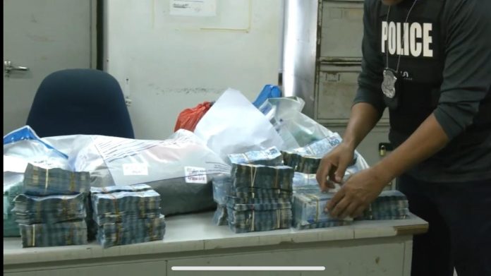 Cops take over $2m in Tacarigua raid, couple arrested